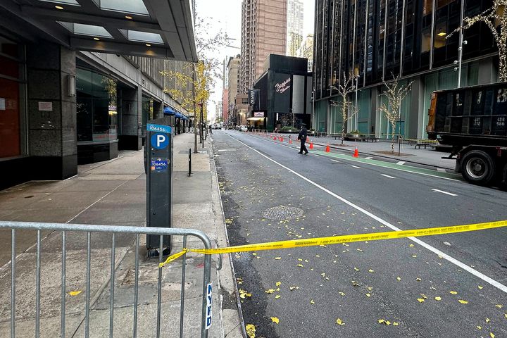 A New York police officer walks outside a hotel where a shooting occurred in Manhattan’s Midtown.