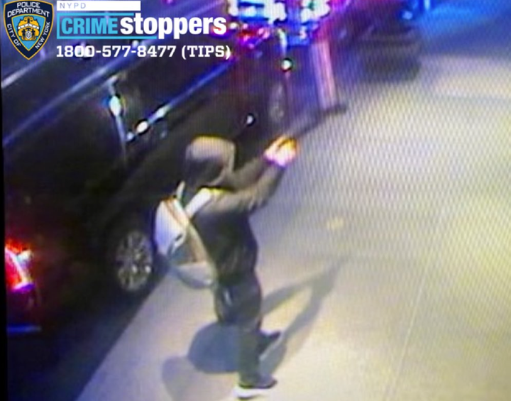 The shooter is seen pointing a gun at Thompson.