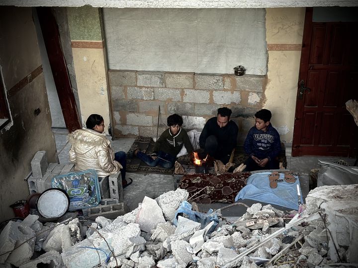 Palestinian Ellaham family, taking refuge in a damaged building