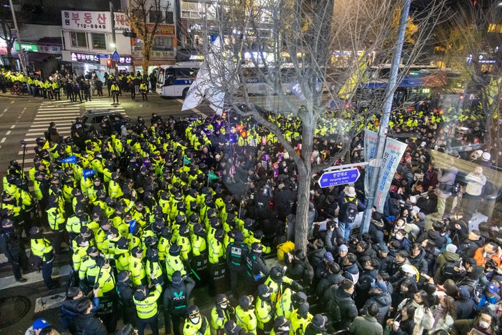 Protesters against South Korean President Yoon Suk Yeol blocked by the police before reaching the presidential office during a demonstration in Seoul, South Korea, on Wednesday, Dec. 4, 2024. South Koreas opposition called for the impeachment of President Yoon Suk Yeol after he plunged the nation into a political crisis by briefly imposing martial law. Photographer: Jean Chung/Bloomberg via Getty Images