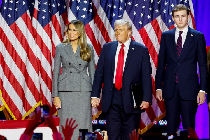 Former US First Lady Melania Trump, from left, former US President Donald Trump, and their son Barron Trump during an election night event at the Palm Beach Convention Center in West Palm Beach, Florida, US, on Wednesday, Nov. 6, 2024. 