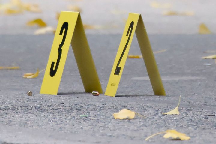 Bullets lie on the sidewalk at the scene outside the Hilton Hotel in midtown Manhattan where Brian Thompson, the CEO of UnitedHealthcare, was fatally shot, on Wednesday.