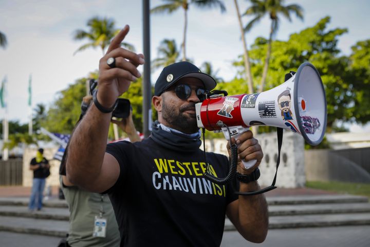 Enrique Tarrio, leader of the Proud Boys, speaks to Black Lives Matter supporters during a gathering to commemorate the first anniversary of the death of George Floyd, in Miami, Florida, on May 25, 2021. 