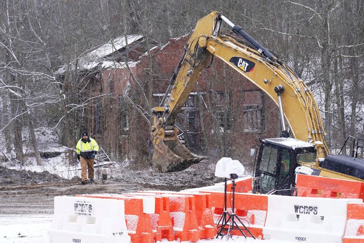 Rescue workers continue to search, Thursday, Dec. 5, 2024, for Elizabeth Pollard, who is believed to have disappeared in a sinkhole while looking for her cat, in Marguerite, Pennsylvania.