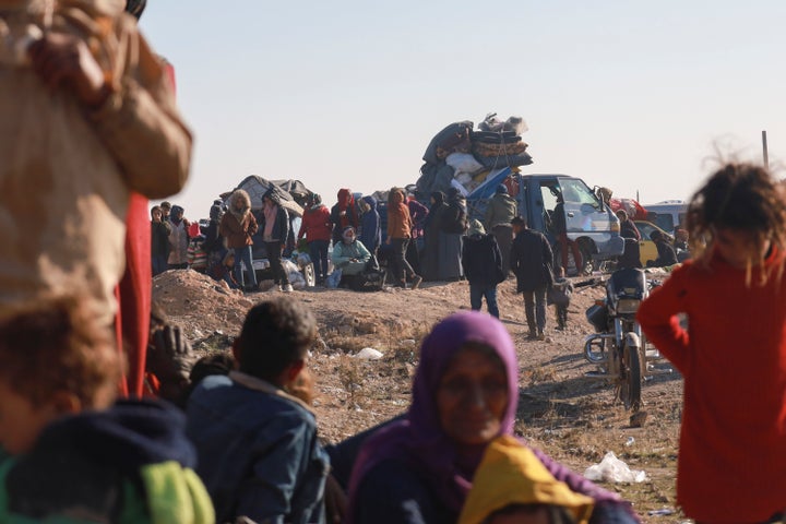 Kurdish people displaced from the Aleppo region arrive to Kurdish controlled areas in Raqqa, Syria, Tuesday Dec. 3, 2024. Thousands of Kurdish families fled Tel Rifaat, north of Aleppo on Tuesday after Syrian opposition groups took control over the city.(AP Photo/Hogir El Abdo)