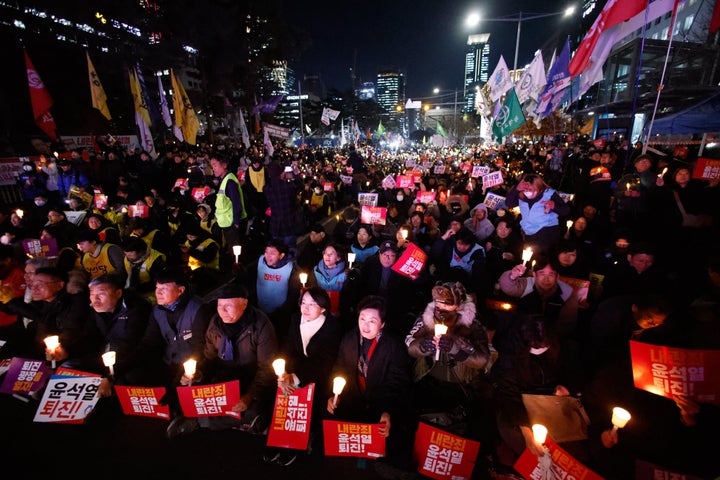 Thousands of citizens gather across from the National Assembly to demand the impeachment of President Yoon Suk-yeol in Seoul, South Korea, on December 6, 2024. South Korea plunges into severe political turmoil after President Yoon declares emergency martial law, accusing the opposition Democratic Party and other parties of destabilizing governance and siding with North Korea. Although the emergency martial law is rescinded following the unanimous passage of a resolution to revoke it by 190 lawmakers, the move sparks widespread criticism, calls for President Yoon's resignation and impeachment, and heightens concerns about its implications for democracy. (Photo by Chris Jung/NurPhoto via Getty Images)