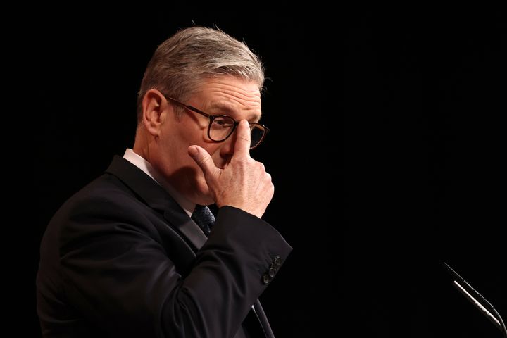 Britain's Prime Minister Keir Starmer adjusts his glasses during his 'plan for change' speech in Buckinghamshire, England, Thursday, Dec. 5, 2024.