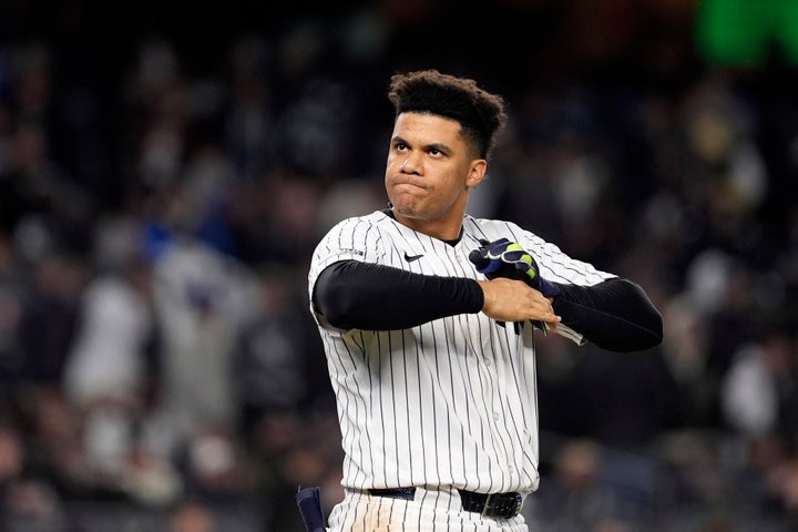 FILE - New York Yankees' Juan Soto takes off his batting gloves after grounding out against the New York Yankees to end the third inning in Game 3 of the baseball World Series, on Oct. 28, 2024, in New York. (AP Photo/Godofredo A. Vásquez, File)