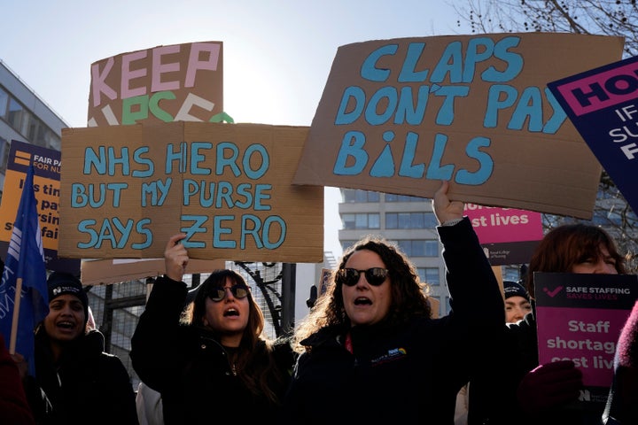 Nurses on strike outside St Thomas' Hospital in London last year.