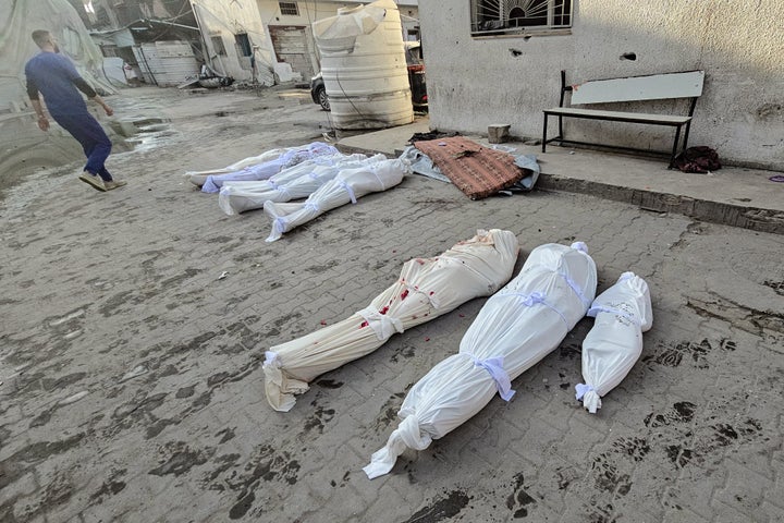 The bodies of Palestinian victims lie in the courtyard of Kamal Adwan hospital in northern Gaza's Beit Lahiya, following Israeli strikes around the medical complex on Dec. 6, 2024.