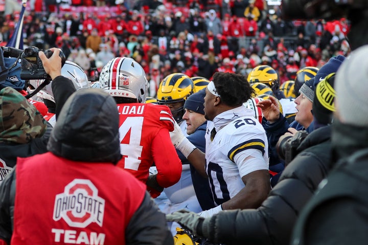 A brawl breaks out at midfield after the game between the Michigan Wolverines and the Ohio State Buckeyes on November 30, 2024, at Ohio Stadium in Columbus, OH.