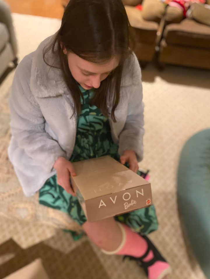 The author’s daughter with Avon Barbie, a Christmas gift.