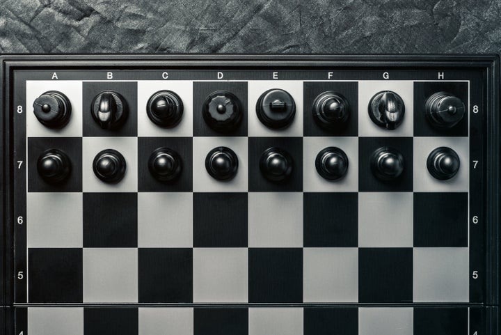 Chess board with black chess in the starting position. Horizontal frame