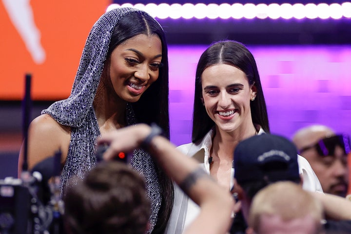 Angel Reese and Caitlin Clark before the 2024 WNBA basketball draft on April 15 in New York City.