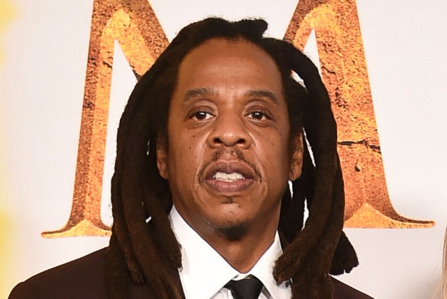 Jay-Z, left, and Beyoncé arrive at the premiere of 