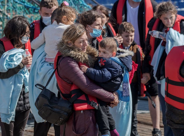 Migrants being escorted back to Dover earlier this year after being picked up in the English Channel.