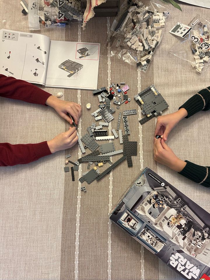 The author's children playing with a Lego set from her holiday stash.