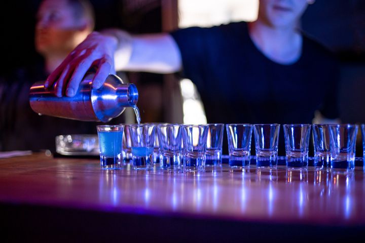 Bartender pouring cocktails in a nightlife bar