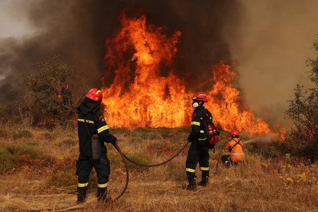 CORINTH, GREECE - OCTOBER 01: Firefighters operate during a wildfire in the Village of Sofiana near Corinth, Greece on October 01, 2024. (Photo by Costas Baltas/Anadolu via Getty Images)