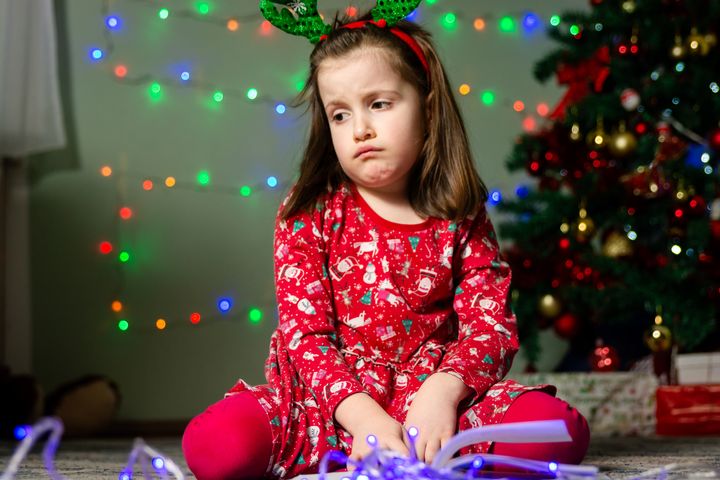 Sad little girl is waiting for Santa