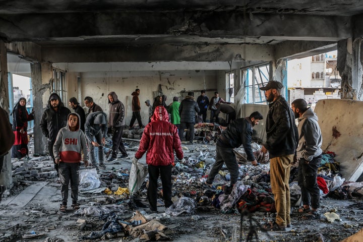 Palestinians inspect the damage following an Israeli attack on an UNRWA school housing displaced families in Khan Younis, Gaza on Dec. 16, 2024.