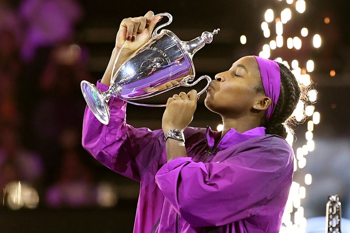 Coco Gauff of the U.S. kisses her trophy after winning against China's Qinwen Zheng in their women's singles final match of the 2024 WTA finals.