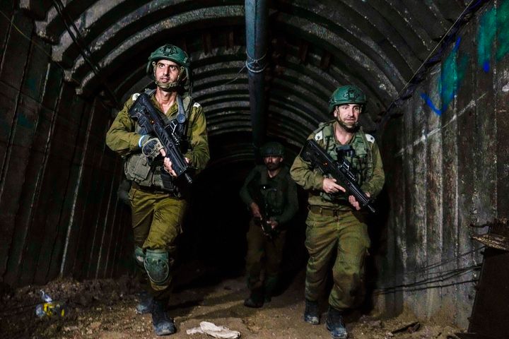 FILE - Israeli soldiers are seen in a tunnel that the military says Hamas militants used to attack the Erez crossing in the northern Gaza Strip, Friday, Dec. 15, 2023. (AP Photo/Ariel Schalit, File)