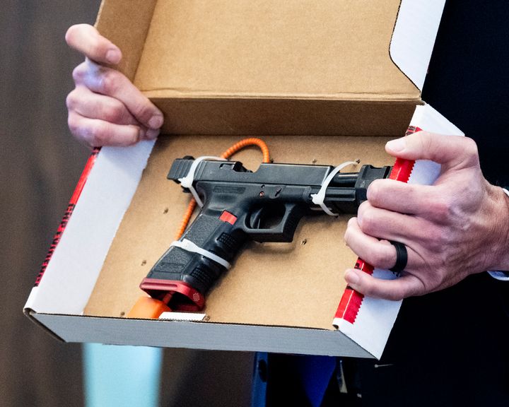 Senior Deputy District Attorney Dan Feldman shows the jury a 9 millimeter handgun in a Santa Ana, California, courtroom on Jan. 18, 2024, that he alleged was used when the defendant shot at a car in 2021, killing a 6-year-old.