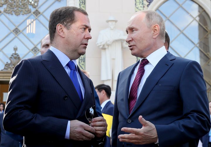 Russian President Vladimir Putin, right, and Dmitry Medvedev