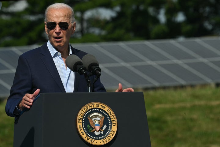 Standing in front of solar panels, President Joe Biden speaks about clean energy investments in Westby, Wisconsin, on Sept. 5.