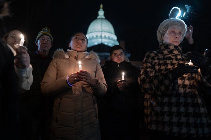 MADISON, WISCONSIN - DECEMBER 17: People attend a vigil on the grounds of the state Capital building to mourn the victims of the shooting at Abundant Life Christian School on December 17, 2024 in Madison, Wisconsin. A 15-year-old female student opened fire at the school, killing a teacher and student and wounding six others, including two critically, before taking her own life, according to police. (Photo by Scott Olson/Getty Images)
