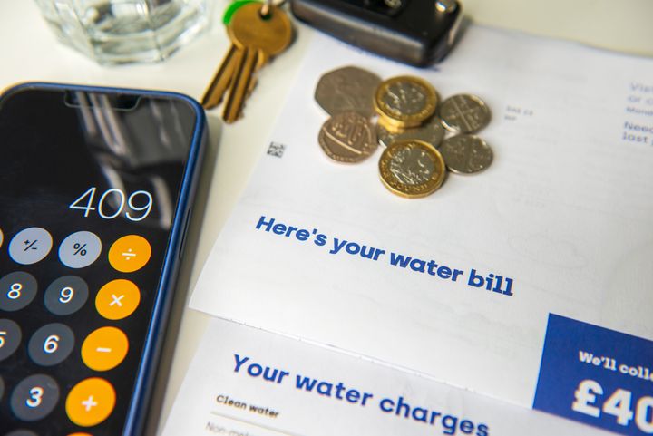 Close-up of Water bill and calculator. Domestic scene.