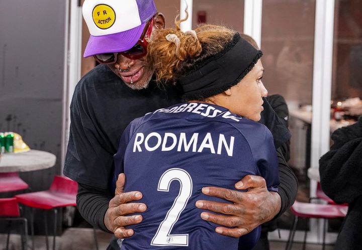 Rodman and her NBA legend father share a hug at a 2021 NWSL playoff game that Trinity said was nearly ruined by his presence.