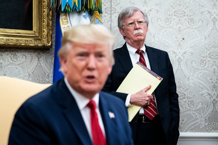 Then-national security adviser John Bolton listens as U.S. President Donald Trump meets with the prime minister of the Netherlands at the White House on July 18, 2019 in Washington.