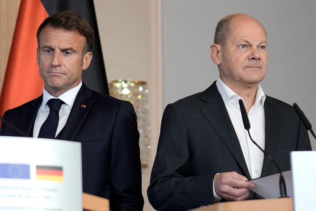 German Chancellor Olaf Scholz, right, and French President Emmanuel Macron,left, speak at a press conference after a joint cabinet meeting of the German and French Government in Hamburg, Germany, Tuesday, Oct. 10, 2023. (AP Photo/Markus Schreiber)