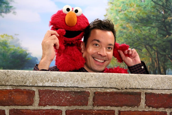 Elmo, left, and Jimmy Fallon during the "Sesame Street Photobomb" sketch on "The Tonight Show with Jimmy Fallon" on Jan. 14, 2016.