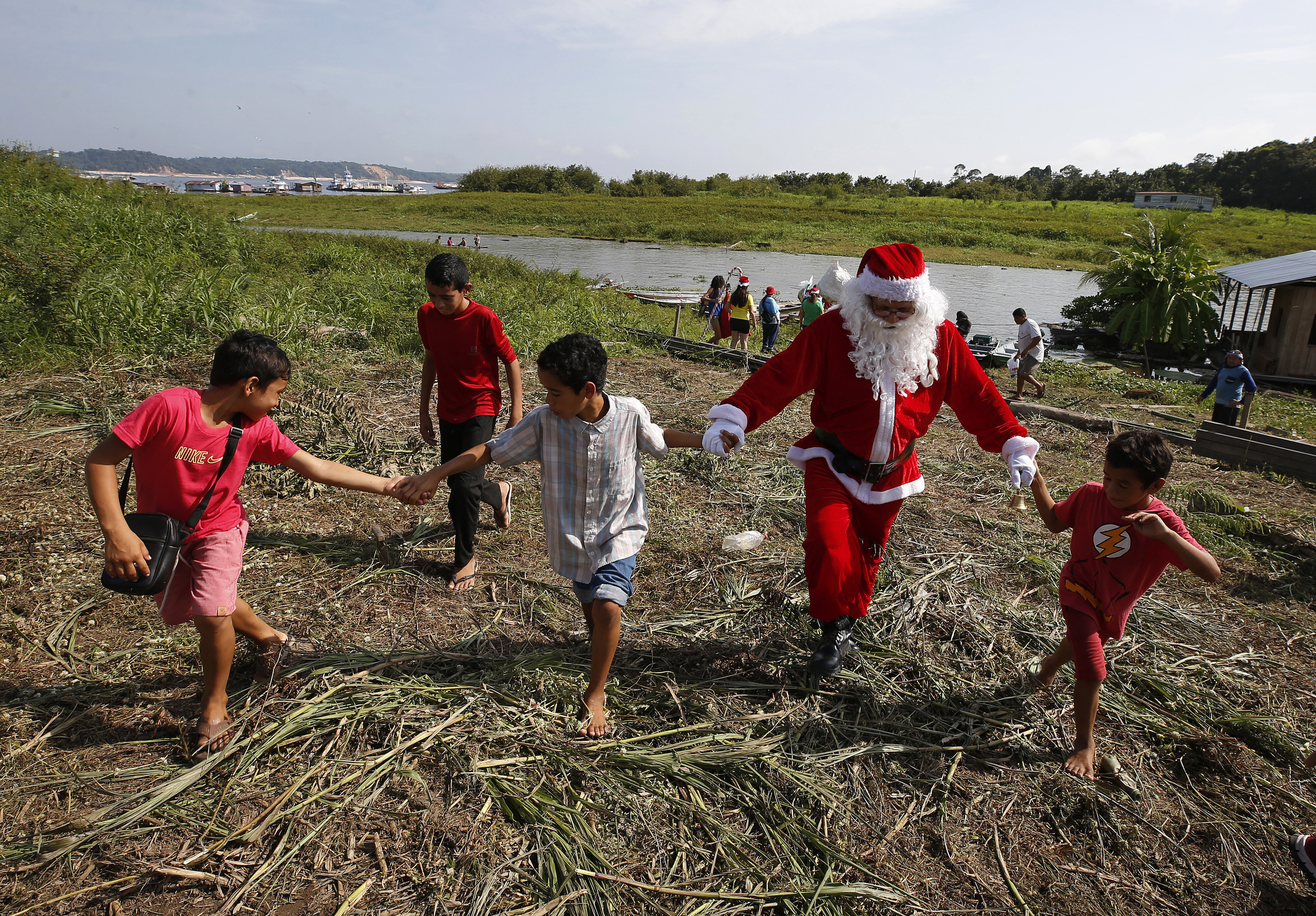 Santa Claus Braves Amazon Jungle To Bring Gifts To Children