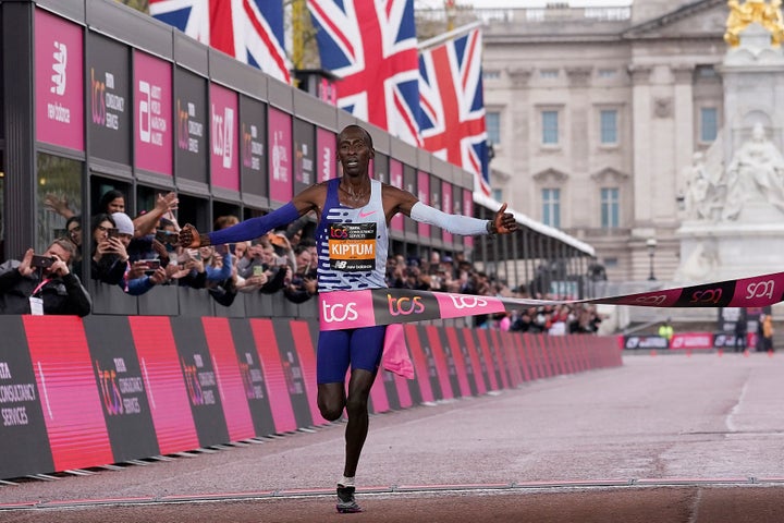 Kenya's Kelvin Kiptum ceosses the finish line to win the men's race at the London Marathon in London, Sunday, April 23, 2023.(AP Photo/Alberto Pezzali)