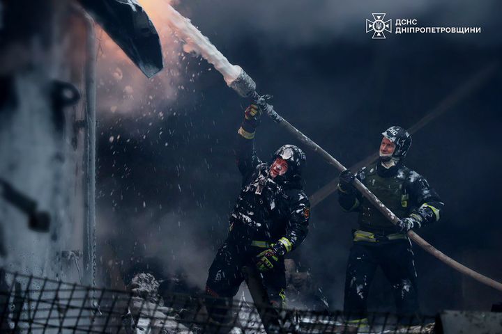 In this image provided by the Ukrainian Emergency Service, firefighters put out a fire following a Russian missile attack on the country's energy system in Dnipropetrovsk region, Ukraine, Wednesday, Dec. 25, 2024. (Ukrainian Emergency Service via AP)