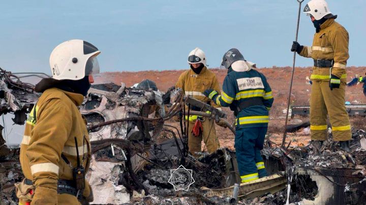 In this photo released by Kazakhstan's Emergency Ministry Press Service, Rescuers work at the wreckage of Azerbaijan Airlines Embraer 190 lays on the ground near the airport of Aktau, Kazakhstan, Wednesday, Dec. 25, 2024. (Kazakhstan's Emergency Ministry Press Service via AP)