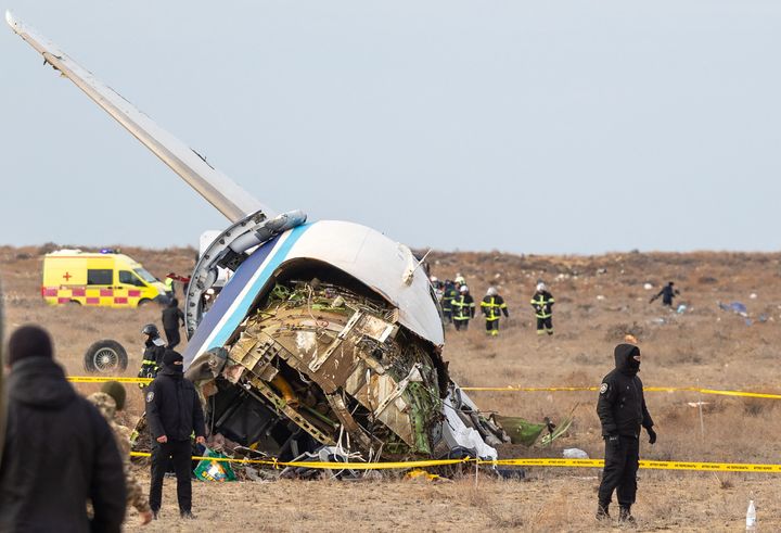 Emergency specialists work at the crash site of an Azerbaijan Airlines passenger jet near the western Kazakh city of Aktau on December 25, 2024. (Photo by Issa Tazhenbayev / AFP) (Photo by ISSA TAZHENBAYEV/AFP via Getty Images)