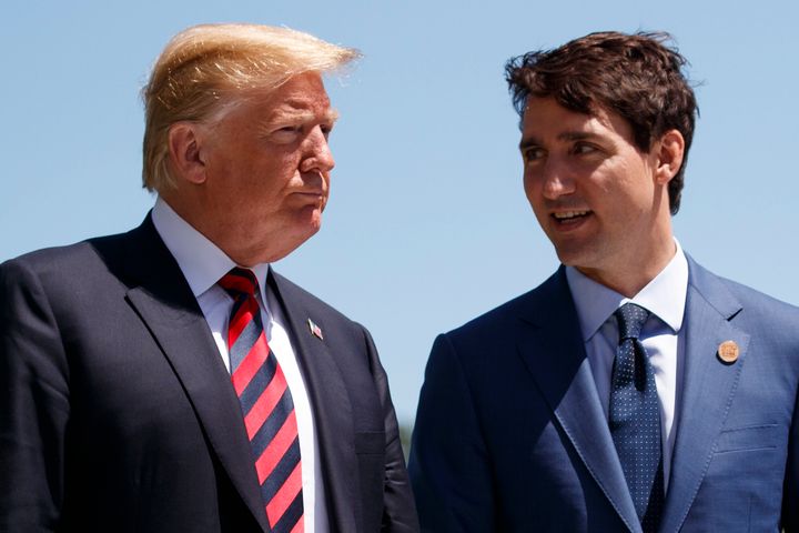 In this June 8, 2018, file photo, President Donald Trump talks with Canadian Prime Minister Justin Trudeau during a G-7 Summit welcome ceremony in Charlevoix, Canada. (AP Photo/Evan Vucci, File)