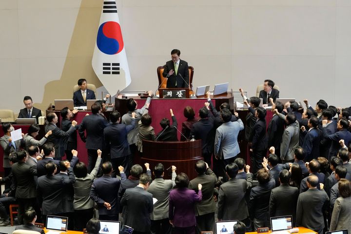 Lawmakers of the ruling People Power Party protest to South Korea's National Assembly Speaker Woo Won Shik, top center, during a plenary session for the impeachment motion against South Korean acting President Han Duck-soo at the National Assembly in Seoul, South Korea, on Dec. 27, 2024.