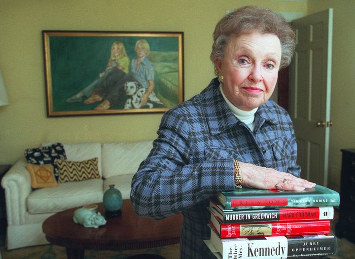 With a portrait of her children John and Martha Moxley, Dorthy Moxley rests on some books written on her daughter's murder at her home in Chatham, New Jersey, on Oct. 22, 1998.