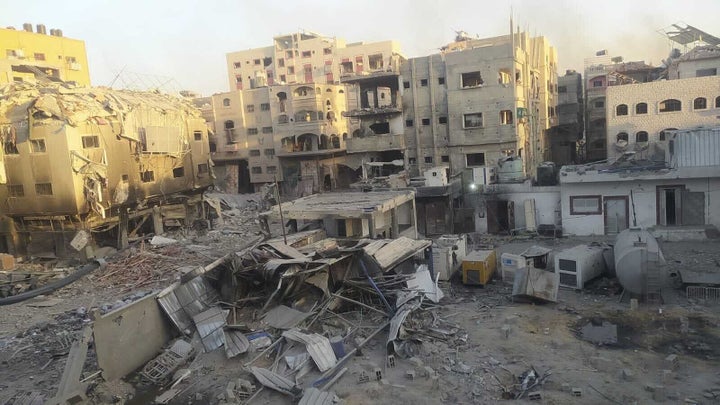 BEIT LAHIA, GAZA - DECEMBER 25: A view of destruction following the Israeli attack on the courtyard of Kamal Adwan Hospital and its surrounding buildings in Beit Lahia, Gaza on December 25, 2024. (Photo by Khalil Ramzi Alkahlut/Anadolu via Getty Images)