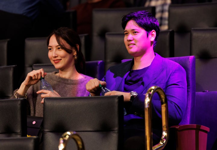 LOS ANGELES, CA - DECEMBER 8, 2024: Dodgers Shohei Ohtani and his wife Mamiko Tanaka sit in the stands to watch the Lakers play the Portland Trailblazers at Crypto.com Arena on December 8, 2024 in Los Angeles, California. (Gina Ferazzi / Los Angeles Times via Getty Images)