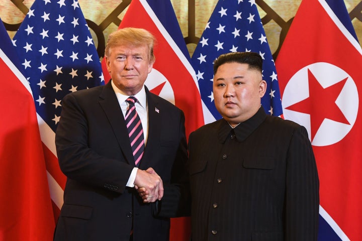 US President Donald Trump (L) shakes hands with North Korea's leader Kim Jong Un before a meeting at the Sofitel Legend Metropole hotel in Hanoi on February 27, 2019. (Photo by Saul LOEB / AFP) (Photo credit should read SAUL LOEB/AFP via Getty Images)