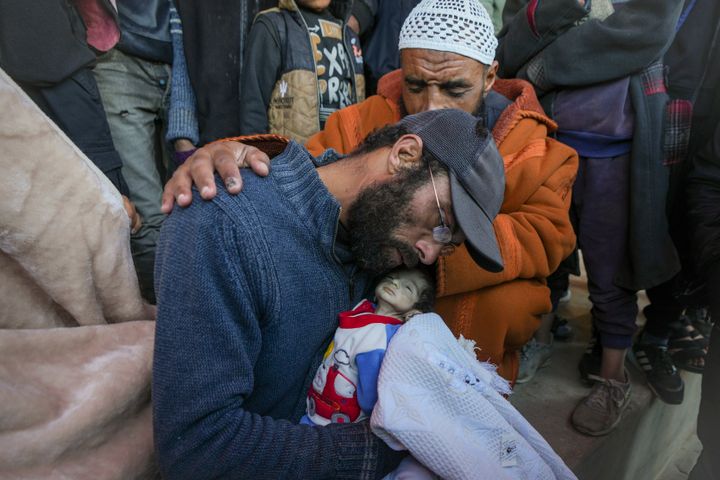 WARNING: GRAPHIC CONTENT (Image shows death) - Yehia al-Batran grieves as he holds the body of 20-day-old Jomaa, his son who died from hypothermia, at Al-Aqsa Martyrs Hospital in Gaza, on Sunday, Dec. 29, 2024. Jomaa's twin brother, Ali, remains in intensive care as local health officials report at least three other recent infant deaths from the cold.