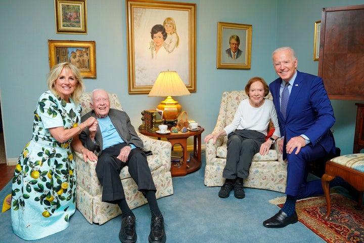 In this April 30, 2021, photo released by The White House, former President Jimmy Carter and former First Lady Rosalynn Carter pose for a photo with President Joe Biden and First Lady Jill Biden at the Carters' home in Plains, Georgia.