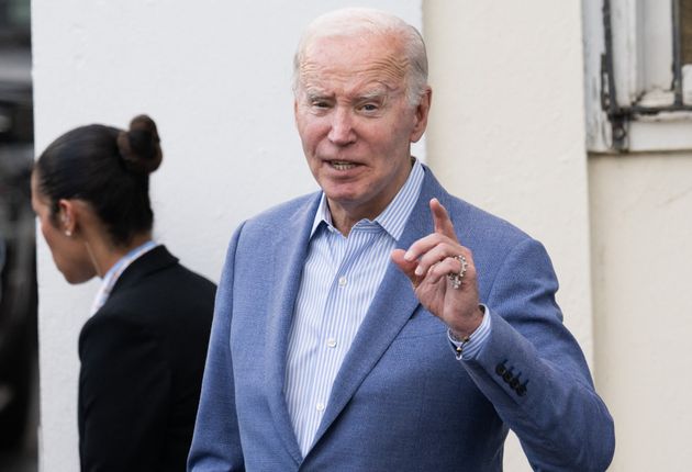 US President Joe Biden answers a question from the press as he exits Holy Cross Catholic Church after attending mass in Christiansted, St. Croix, on the US Virgin Islands, on December 28, 2024